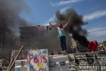 Protester standing on top of a barricade during a demonstration near Taksim Square in Istanbul, Turkey, June 11, 2013. (Lam Yik Fei/Getty)