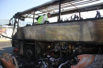 Israeli ZAKA emergency rescue team examining the remains of the bus at the scene of the Hezbollah terrorist attack in Burgas, Bulgaria, July 19, 2012. (Dano Monkotovic/FLASH90/JTA)