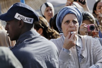 An Orthodox woman blows a whistle in protest against efforts to promote women's prayer at Jerusalem's Western Wall, July 8, 2013. (Miriam Alster/FLASH90)