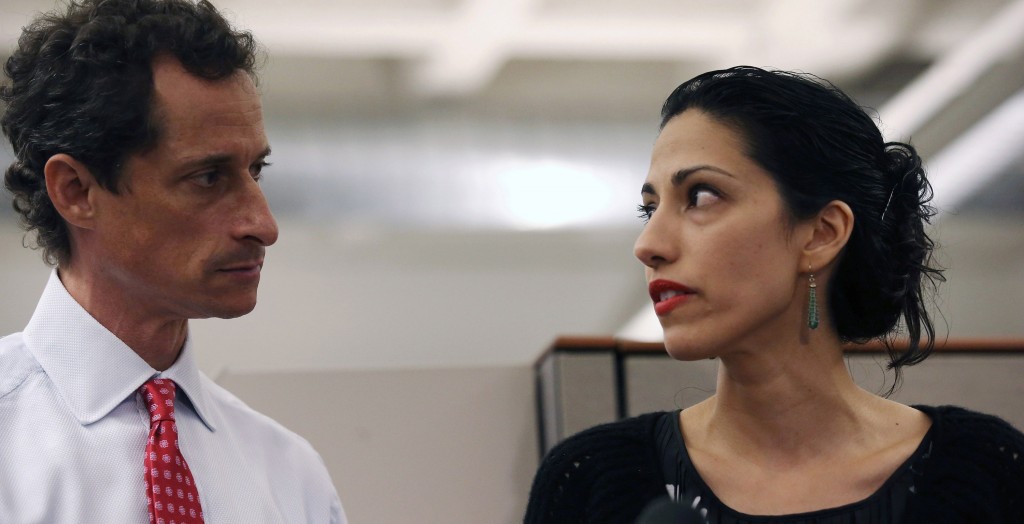  New York mayoral candidate Anthony Weiner and wife Huma Abedin at a news conference in New York City at which Weiner acknowledged that he engaged in lewd online conversations with a woman after his resignation from Congress, July 23, 2013. (Photo by John Moore/Getty Images)