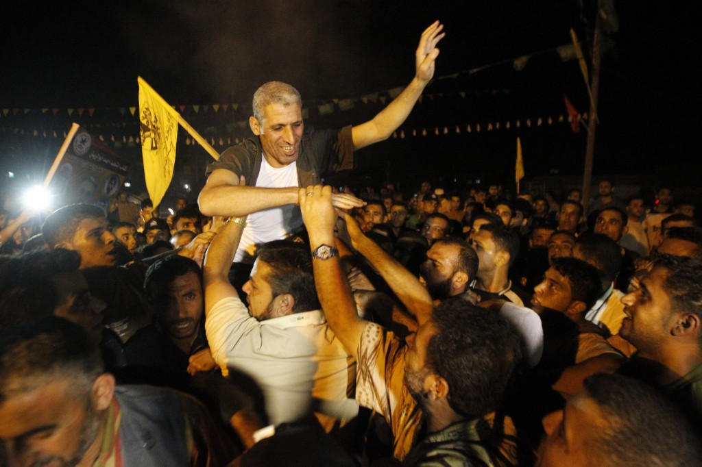 JTA BRIEF PHOTO: As prisoner release begins, rockets fired at Israel Freed Palestinian prisoner Ateya Abu Moussa, who was held by Israel for 20 years, is greeted by his relatives and friends upon arrival at his family's house in Khan Younis in the southern Gaza Strip, Aug. 14, 2013. (Abed Rahim Khatib / Flash 90/JTA)