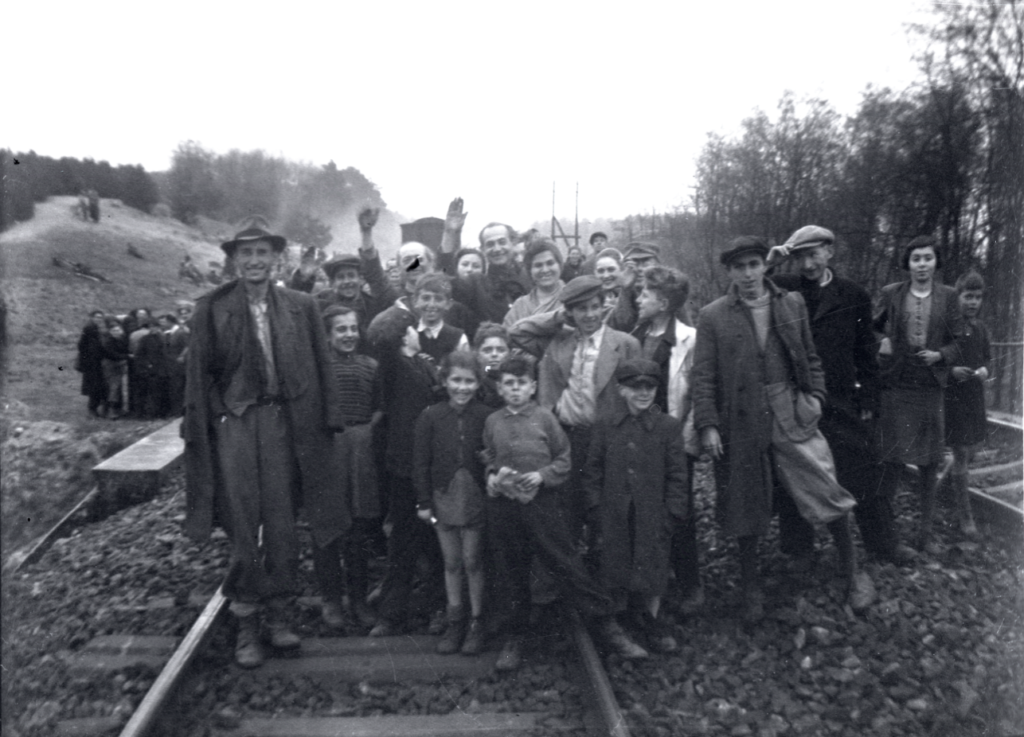 Former inmates who were transported by train from Bergen-Belsen were photographed in Farsleben, Germany, shortly after their liberation by U.S. troops on Apr. 13, 1945. (United States Holocaust Memorial Museum, courtesy of George Gross)