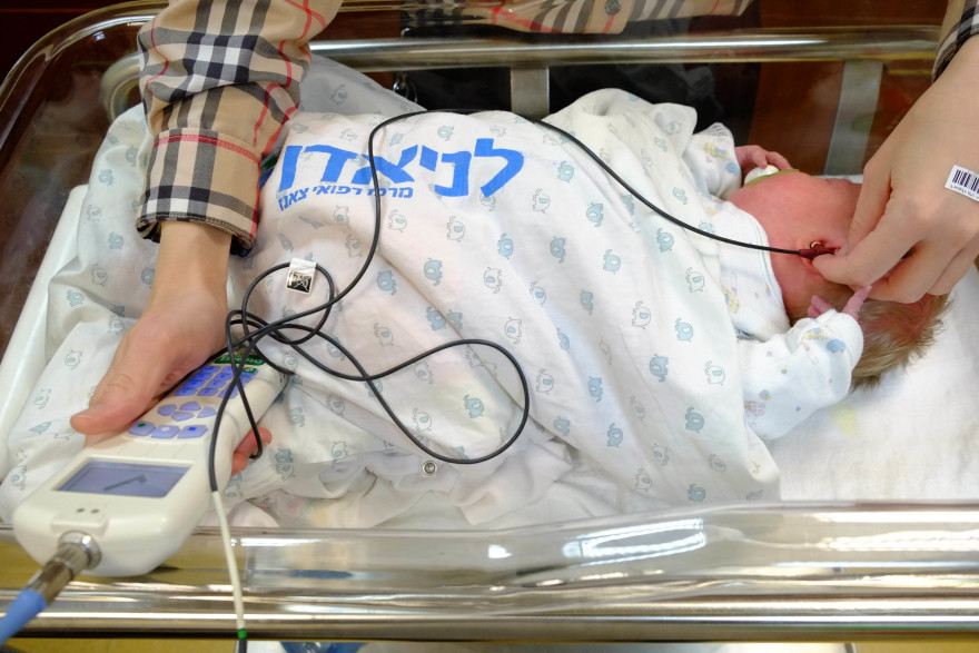 A newborn baby receives a hearing test at the hospital in December 2013. Israeli boys born in 2013 can expect to live past 80, according to the World Health Organization.  Photo by Chen Leopold/Flash90