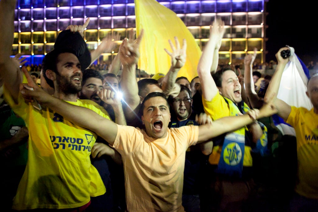 Thousands of Maccabi Tel Aviv fans celebrated at Rabin Square in Tel Aviv Sunday night as the Israeli team won in the Euroleague Finals, on May 18. (Amir Levy/Flash90