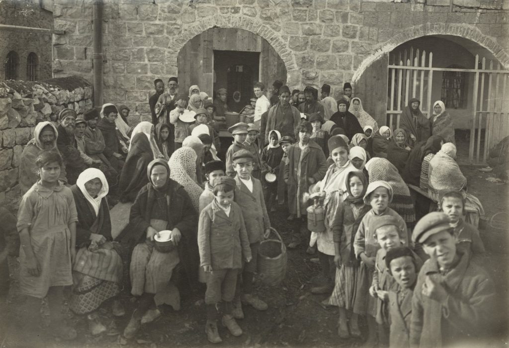 Jews wait for food outside the JDC-supported Dreyfus soup kitchen in Jerusalem in 1921. (Courtesy JDC)