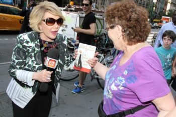 Joan Rivers talks with people on the street while promoting her new book 'Diary of a Mad Diva' on June 30, 2014 in New York City. (Rob Kim/Getty Images)