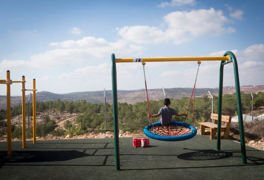 Children seen playing in the streets of the settlement of "Gevaot," Sept. 2, 2014. Part of the settlement, located near the West Bank city of Bethlehem, was declared as Israeli state land on Aug. 31. (Miriam Alster/Flash 90)