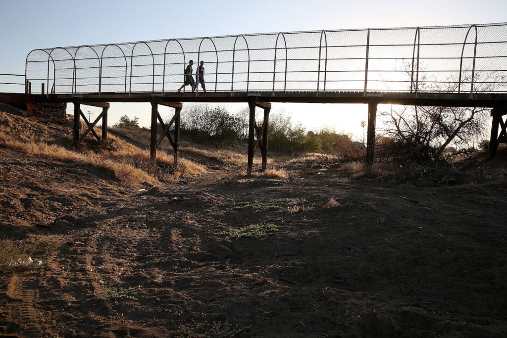A footbridge spans a completely dry river bed, Sept. 4, 2014 in Porterville, Calif. (Justin Sullivan/Getty Images)