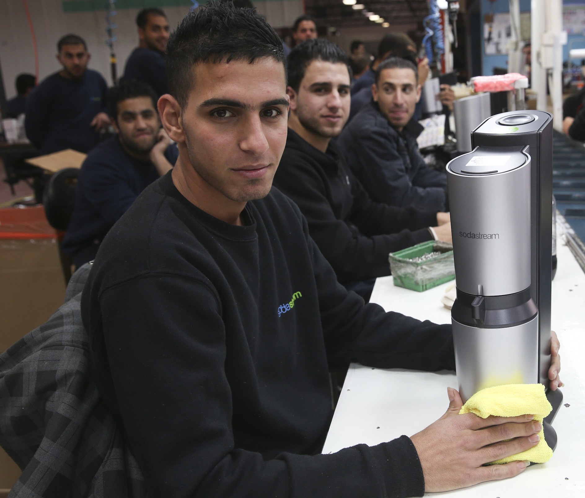 Some of the hundreds of Palestinians who work at SodaStream's West Bank factory that is shutting down. (Nati Shohat/Flash90)