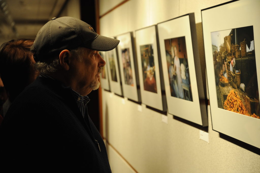 A visitor examines a photo by Nobel Laureate Martin Kaplus at the opening of an exhibition of his photographs in Washington, Jan. 14, 2015. (Peter Cutts/Austrian Cultural Forum)