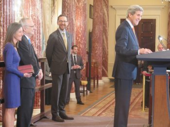 Rabbi David Saperstein (2nd from left) with his wife (left) watches as Secretary of State John Kerry introduces him at Saperstein's swearing-in as the U.S. envoy on religious freedom on Friday Feb. 20 at the State Department (courtesy Ellen Weiss)