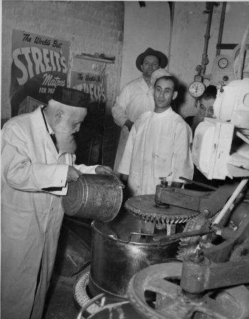 Mixing water with flour to make matzah dough at Streit's Matzo Factory on Manhattan's Lower East Side, date unknown. (Courtesy of Streit's Matzos)