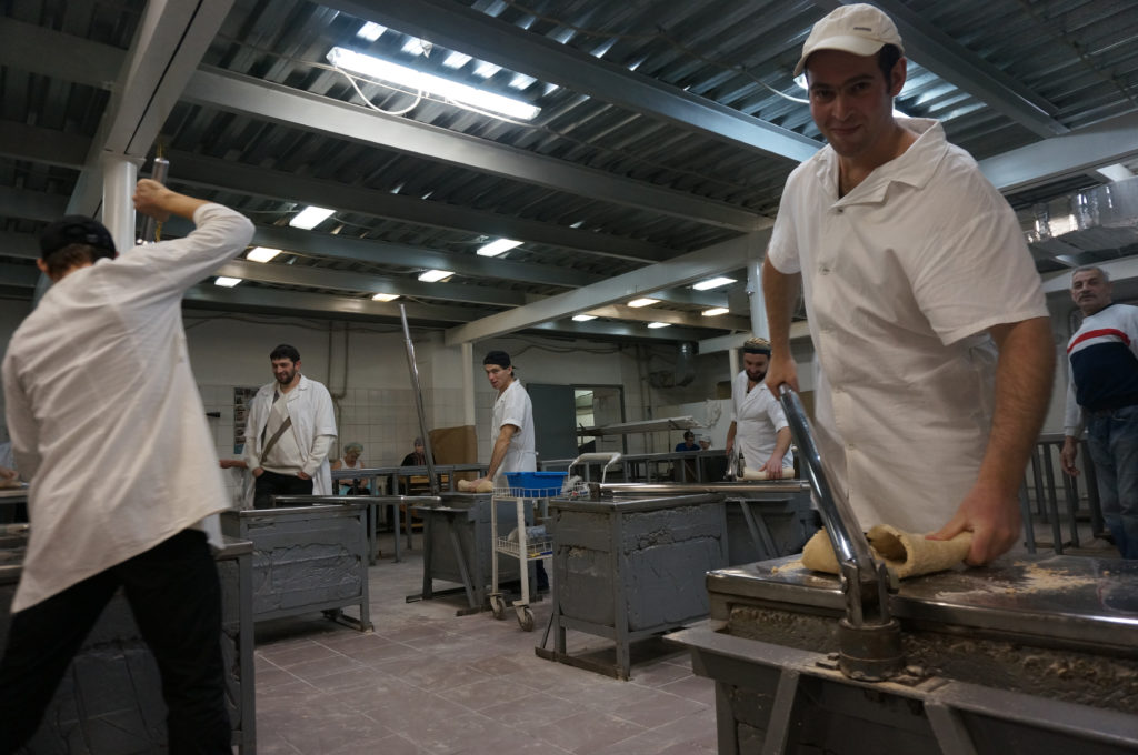 Binyamin Vestrikov, right with other workers at the Tiferet HaMatzot factory in Dnepropetrovsk on Dec. 8, 2014. (Cnaan Liphshiz/JTA)