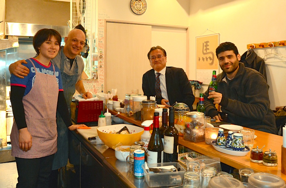 Dan Zuckerman, second from left, at his restaurant Ta-im in Tokyo, Dec. 24, 2015. (Cnaan Liphshiz)