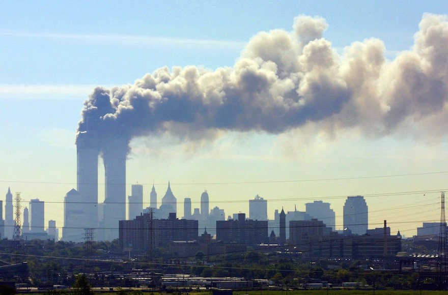 Smoke billowing from the twin towers in New York City on September 11, 2001. (Gene Boyars/AP Images)