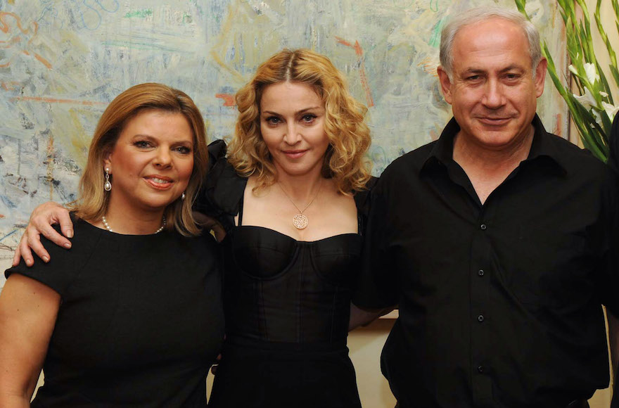 Madonna, center, with Israel Prime Minister Benjamin Netanyahu, right, and his wife Sara Netanyahu, left, at the Prime Minister's residence in Jerusalem on Sept. 4, 2009. (Avi Ohayon/GPO via Getty Images)