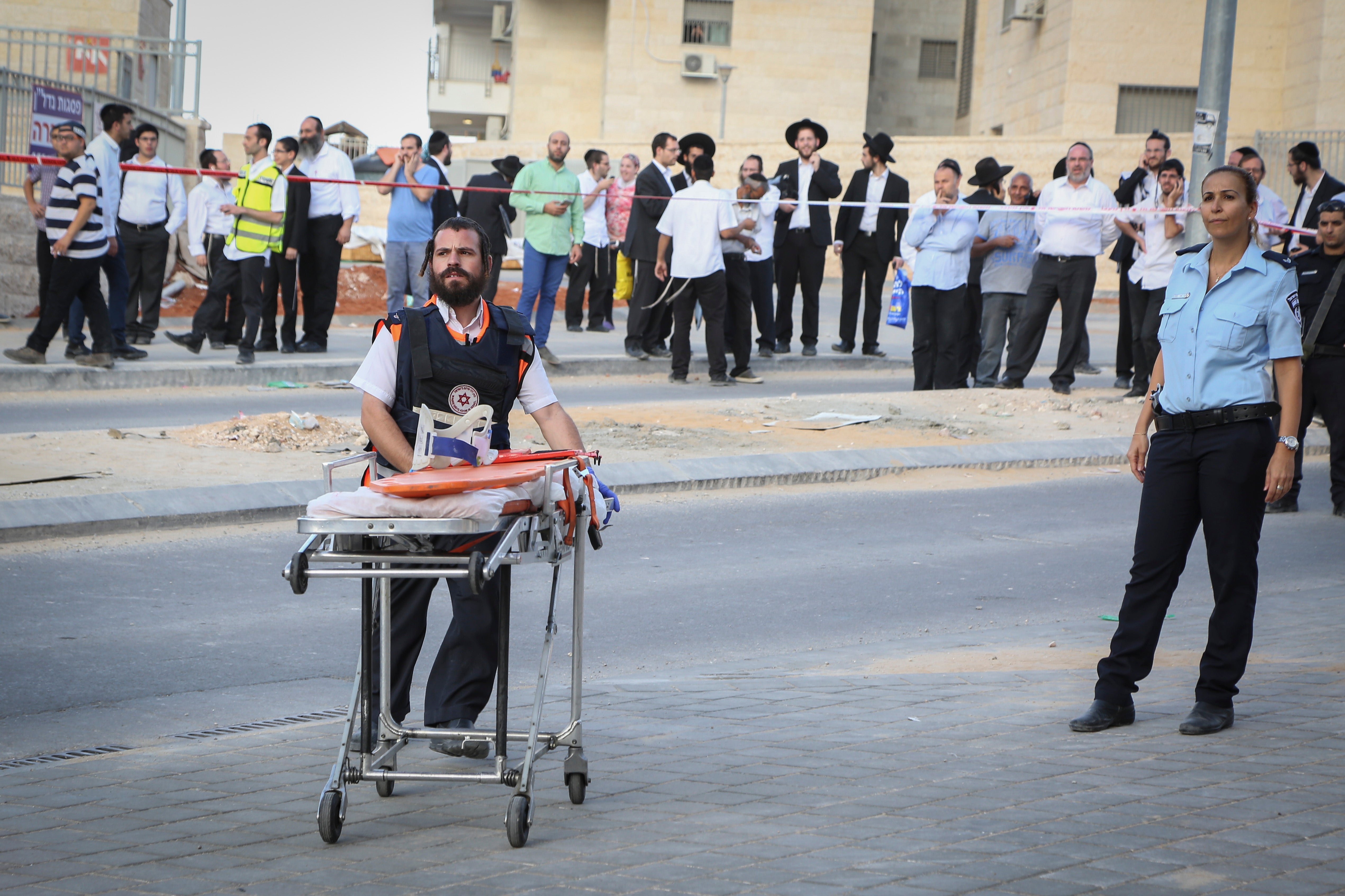 A paramedic rushing to the scene where two terrorists were shot by police after attempting to carry out a stabbing attack in Beit Shemesh, Israel, October 22, 2015. (Yaakov Lederman/Flash90)