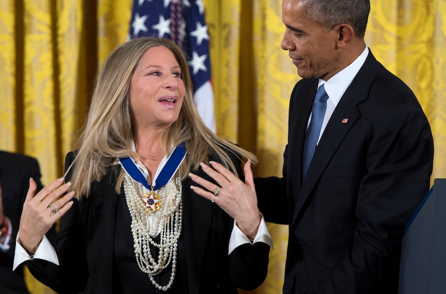 President Barack Obama, right, presenting the Presidential Medal of Freedom to Barbra Streisand during a ceremony in the East Room of the White House in Washington, D.C., Nov. 24, 2015. (Evan Vucci/AP Images)