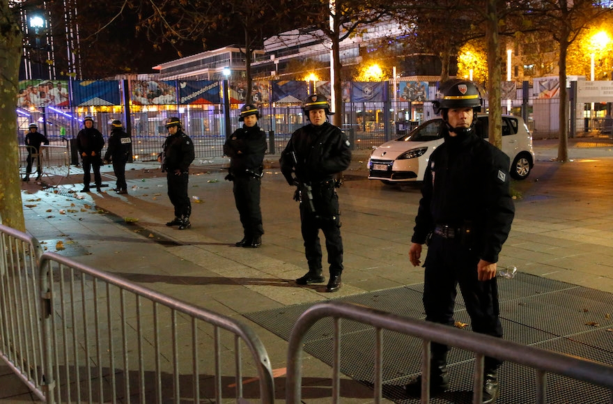 Police officers securing the Stade de France stadium during the soccer match between France and Germany in Saint Denis, outside Paris, Nov. 13, 2015. (Michel Euler/AP Images)