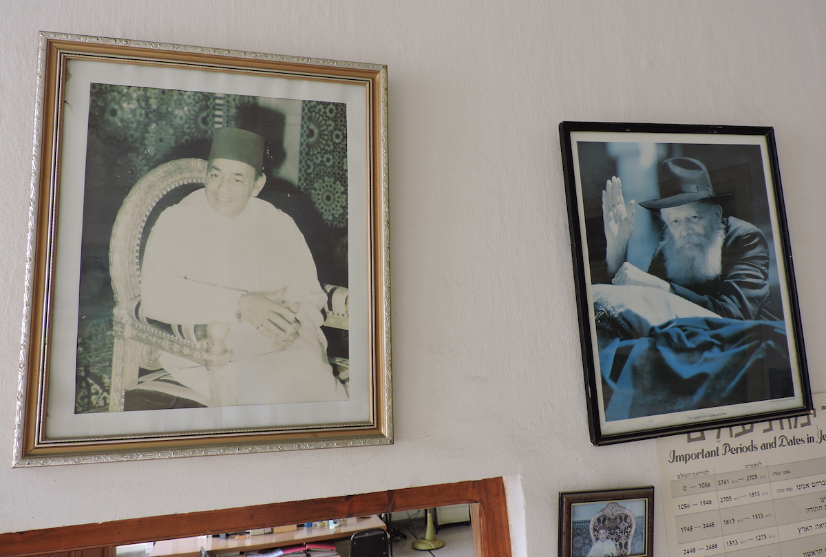 Photos of King Hassan II and Rabbi Menachem Mendel Schneerson adorn the wall of the Chabad facility in Casablanca. (Ben Sales)