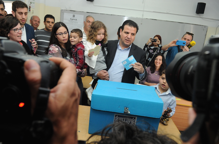 Ayman Odeh casting his vote at a ballots station in Nazareth, Israel on election day, March 17, 2015. (Basal Awidat/Flash90)