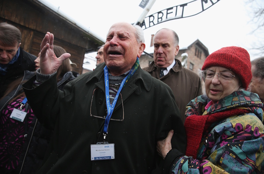 Mordechai Ronen, who was a prisoner at the Auschwitz concentration camp when he was an 11-year-old child and lost his mother, father and sisters there, breaking into tears as he walks through the camp, which is now a museum in Oswiecim, Poland, Jan. 26, 2015. (Sean Gallup/Getty Images)