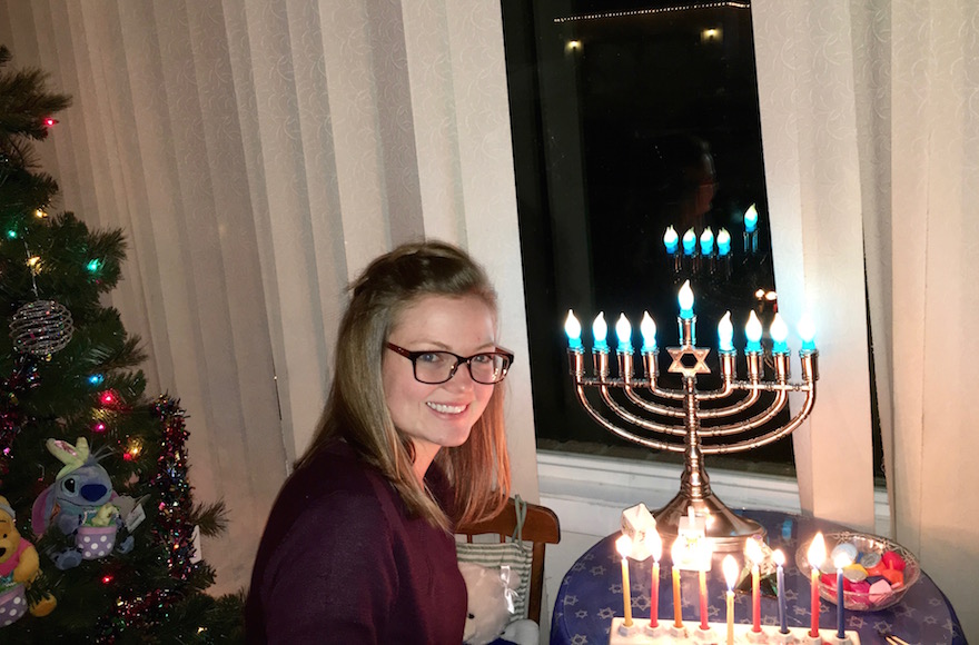 Phyllis Miller's daughter Kaytlyn lighting Hanukkah candles. (Courtesy of Phyllis Miller)