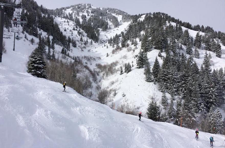 People skiing at Snow Basin, Utah.