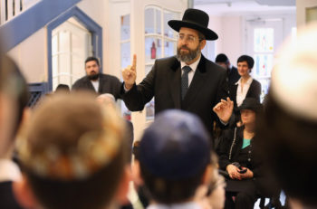David Lau, Ashkenazi chief rabbi of Israel, speaking to children about the Kristallnacht pogroms at the Or Avner traditional Jewish school in Berlin, Germany, Nov. 8, 2013. (Sean Gallup/Getty Images)