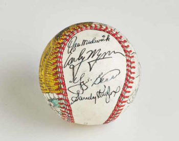 Another one of Jeff Aeder's prized possessions is a custom baseball signed by Sandy Koufax and other Hall of Famers, like Yogi Berra. (Courtesy of Jeff Aeder)