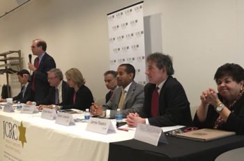Left to right: Congressional candidates Joel Rubin, David Anderson (standing), David Trone, Kathleen Matthews, State Del. Kumar Barve, Will Jawondo, State Sen. Jamie Raskin and State Del. Ana Sol Gutierrez debate in Rockville, Maryland at an event convened by the Jewish Community Relations Council of Greater Washington, April 17, 2016. (Ron Kampeas)