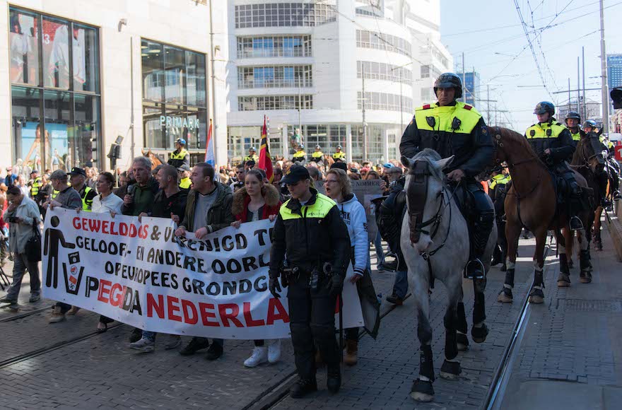 Demonstrators protesting against the arrival of Muslim immigrants to Europe at a PEGIDA event in The Hague, the Netherlands, April 10, 2016. (Cnaan Liphshiz)