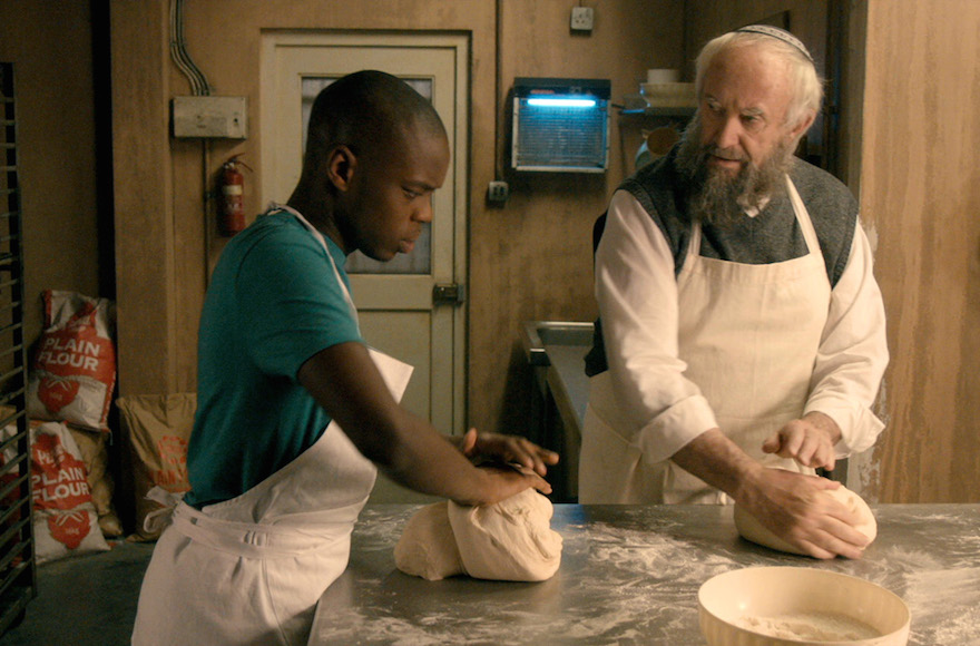 Jerome Holder, left, and Jonathan Pryce in a scene from "Dough." (Courtesy of Viva Films.)