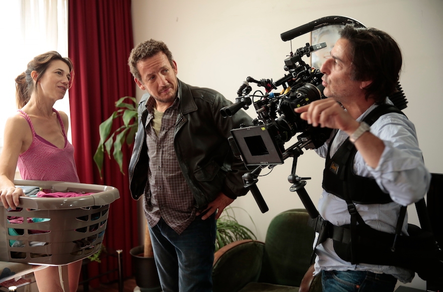 Director Yvan Attal, right, with Charlotte Gainsbourg and Dany Boon during the filming of "The Jews" in Paris. (Courtesy of Wild Bunch Productions)