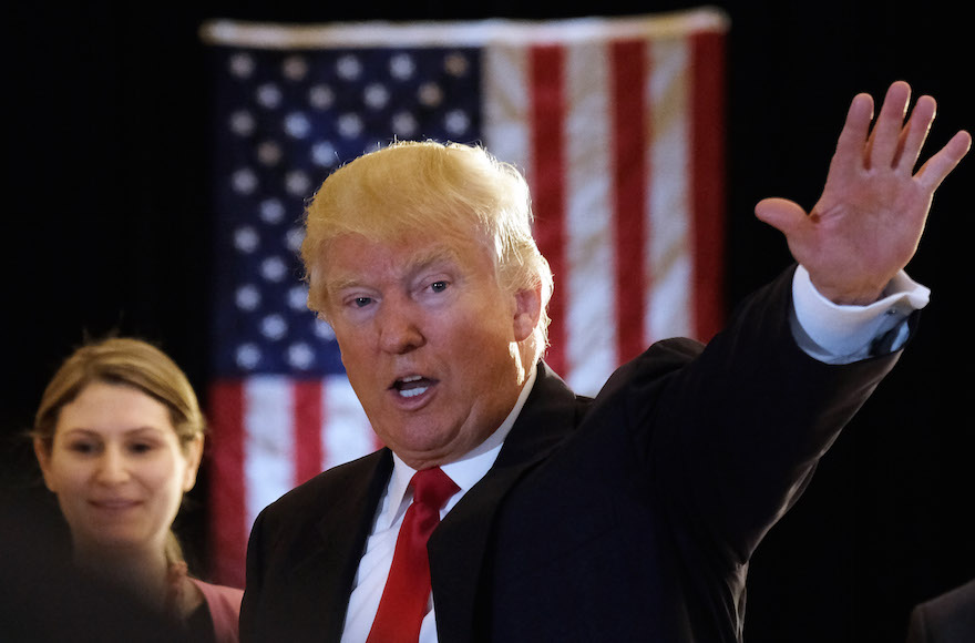 Donald Trump waving after a press conference at the Trump Tower in New York, May 31, 2016. (Jewel Samad/AFP/Getty Images)