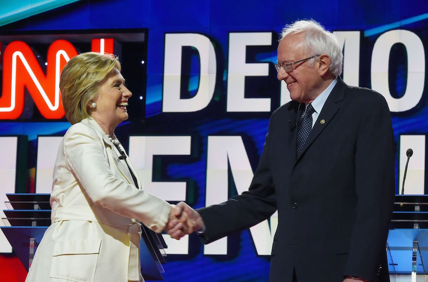 Hillary Clinton, left, and Bernie Sanders shaking hands before the CNN Democratic Presidential Debate at the Brooklyn Navy Yard in New York, April 14, 2016. (Jewel Samad/AFP/Getty Images)