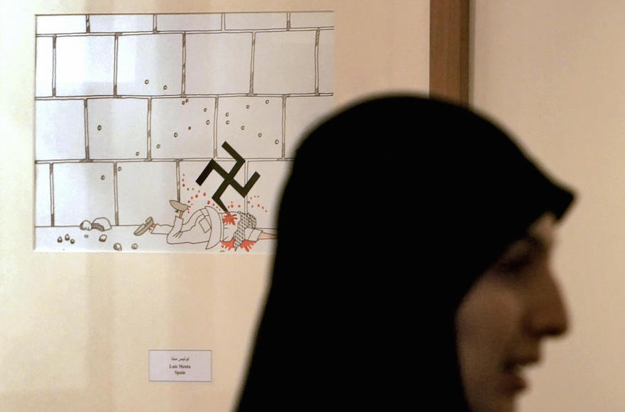 An Iranian woman attending the international cartoon contest on the Holocaust in Tehran, Aug, 14, 2006. (Behrouz Mehri/Getty Images)