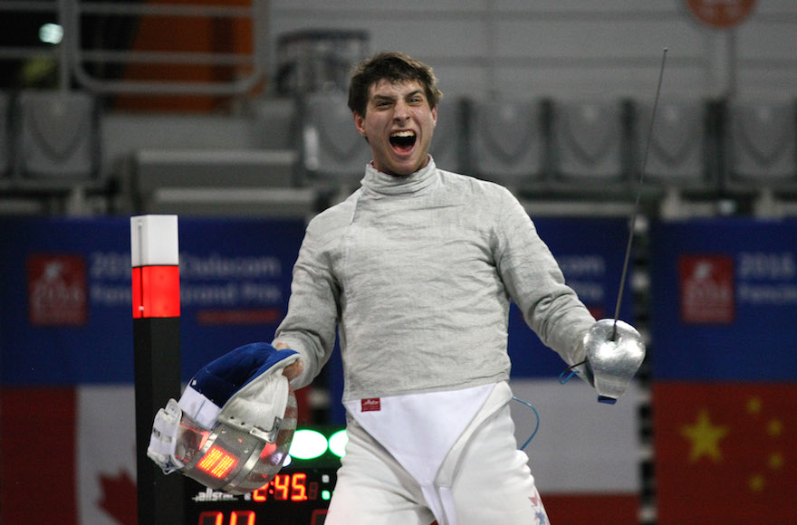 SEOUL, SOUTH KOREA - MARCH 26: In this handout image provided by the FIE, Eli Dershwitz of the USA celebrates his 12:9 victory over Iran's Mojtaba Abedini to win the individual Men's Sabre match during day 2 of the FIE Grand Prix on March 26, 2016 in Seoul, South Korea. (Photo by Mark Deibert/FIE via Getty Images)