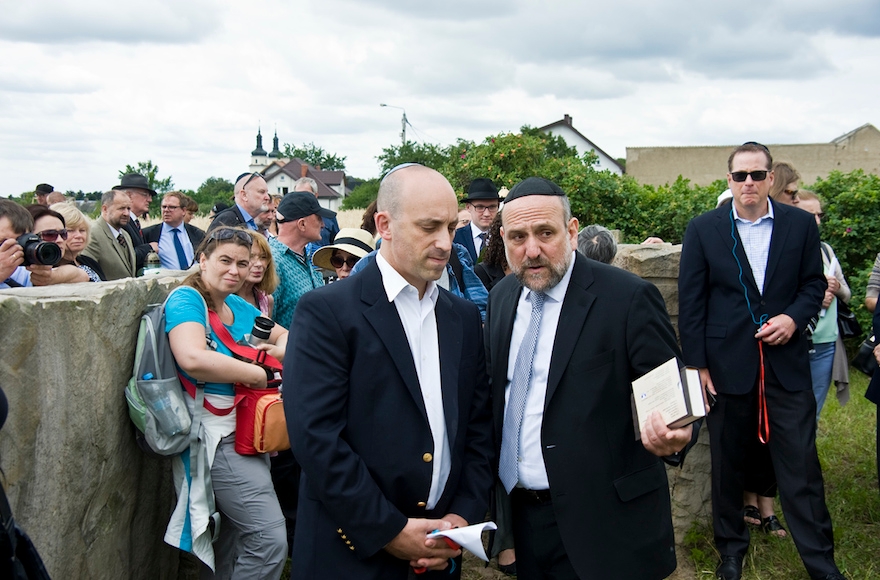  Jonathan Greenblatt, CEO of the Anti-Defamation League, confers with Rabbi Michael Schudrich, Chief Rabbi of Poland, during a ceremony commemorating the 75th anniversary of the massacre at Jedwabne. (Courtesy of the ADL)