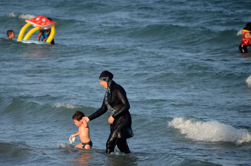 A woman wearing a "burkini", a full-body swimsuit designed for Muslim women, at a beach near Bizerte, Tunisia, Aug. 16, 2016. (Fethi Belaid/AFP/Getty Images)