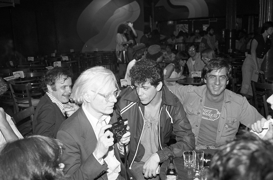 Danny Fields, right, with Andy Warhol, left, and Lou Reed, center, at a David Johansen show at the Bottom Line in New York City, July 20,1978. (Ebet Roberts/Redferns/Getty Images)