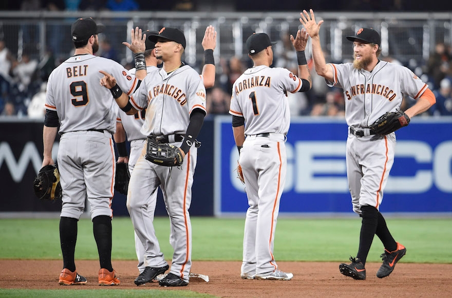 San Francisco Giants players celebrating a win against the San Diego Padres in a baseball game at PETCO Park, Sept. 22, 2016. (Denis Poroy/Getty Images)