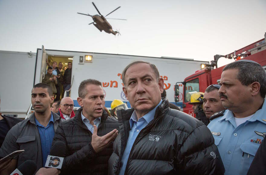 Prime Minister Benjamin Netanyahu visiting the scene of a fire at Zichron Yaakov in northern Israel, Nov. 23, 2016. (Emil Salman/Pool)
