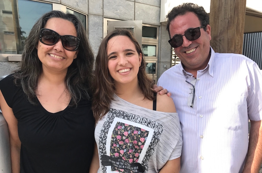 Karen Kadosh leaving the U.S. Embassy in Tel Aviv with her parents, Nov. 14, 2016. (Andrew Tobin)