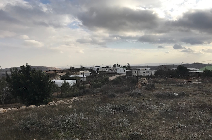 Amona standing atop a hill in the northern West Bank on Dec. 13, 2016. (Andrew Tobin)