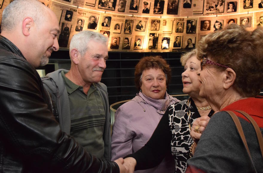 First cousins who thought their entire families died in the Holocaust unite at the Yad Vashem Holocaust museum in Jerusalem, Dec. 13, 2016. (Courtesy of Yad Vashem)