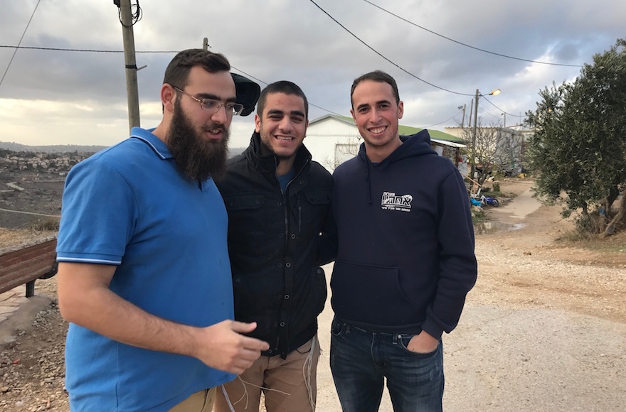 From left to right, Eliav Amir, David Rappaport and Chen Jan visiting Amona, the West Bank, Dec. 13, 2016. (Andrew Tobin)