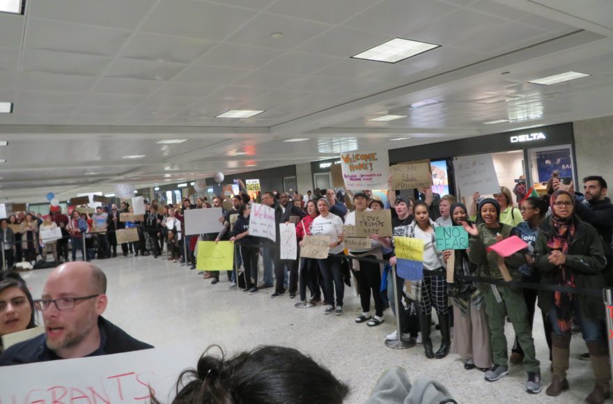 Protesters welcoming Muslim visitors at Dulles International Airport in Virginia, Jan. 28 2017. (Ron Kampeas)