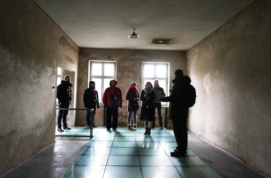Journalists and a spokesperson of the Auschwitz museum visiting a former disinfection facility, Dec. 1, 2016. (Cnaan Liphshiz)