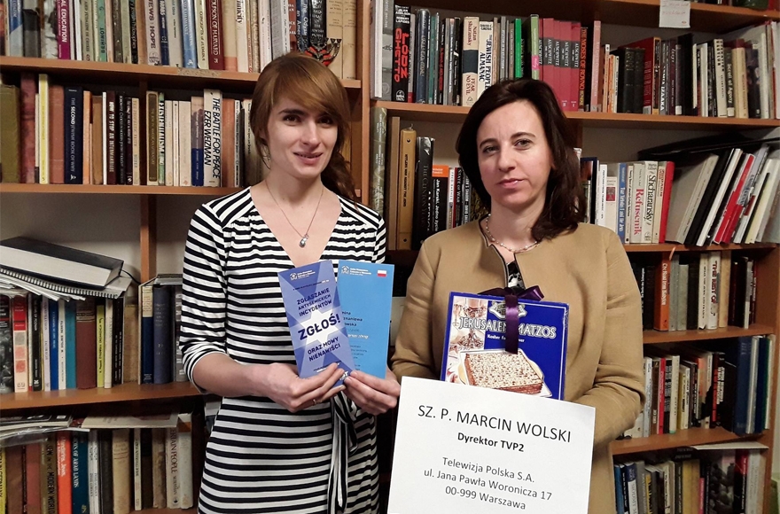 Anna Chipczynska, president of the Jewish Community of Warsaw, right, and Ania Bakula holding the contents of a package they sent to a TV director on Jan. 22, 2017. (Photo Courtesy of the Jewish Community of Warsaw)